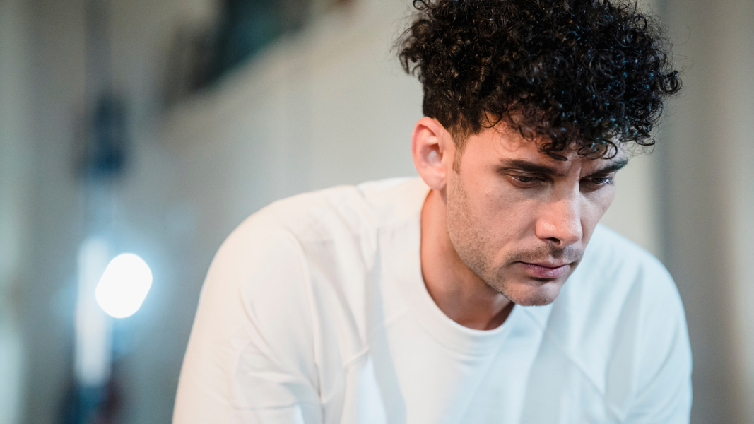 High-Quality Wallpaper - Man in White Shirt Contemplating Thoughts